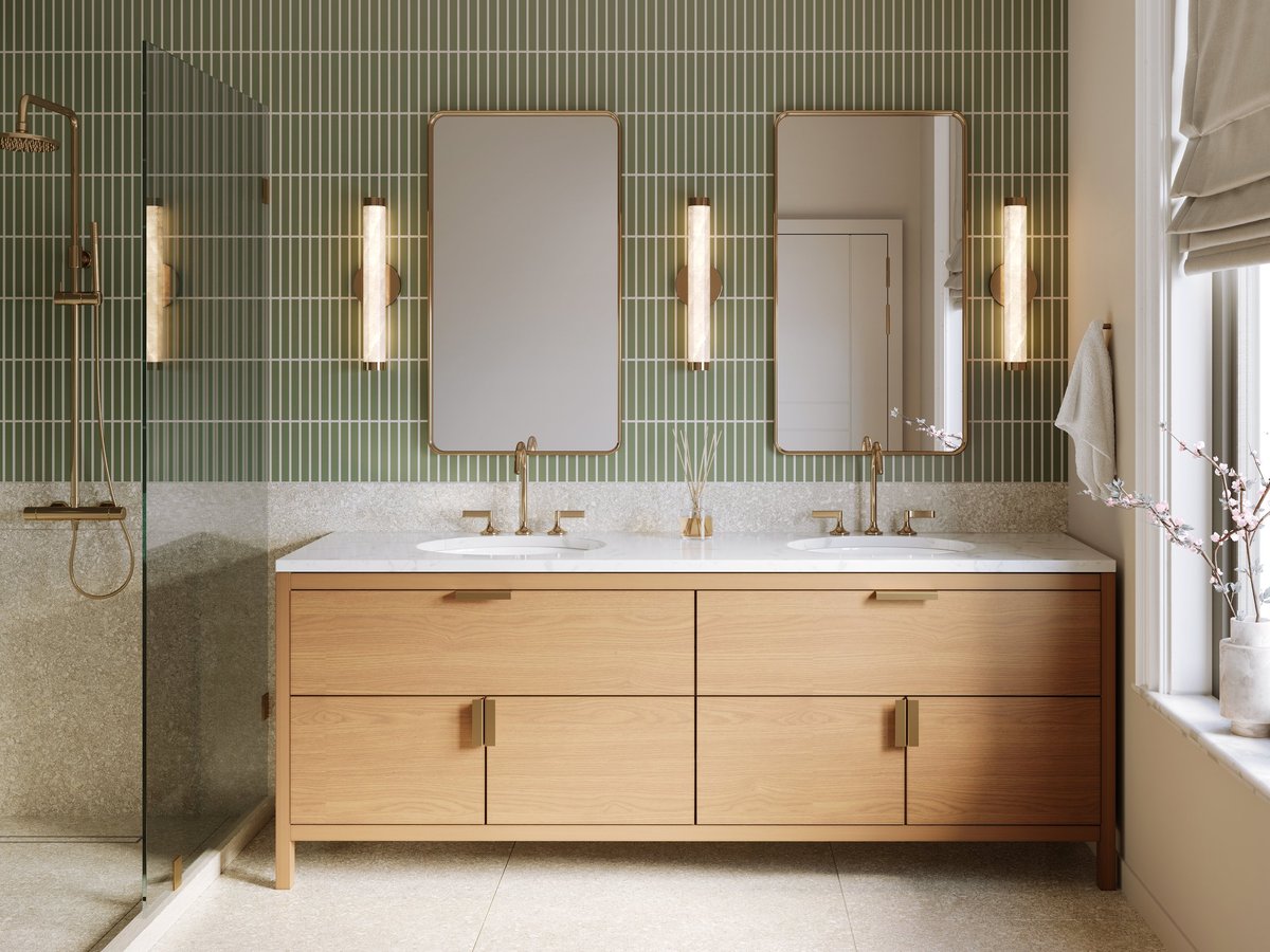 Modern bathroom with green wall tile and brass fixtures